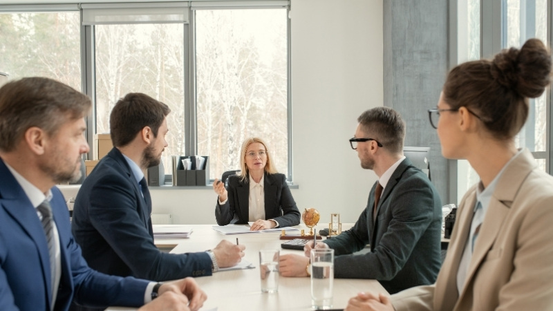 Team of lawyers discussing strategy in a conference room.
